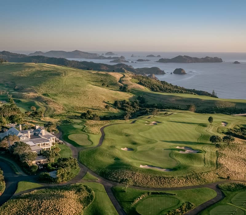 Aerial view of Rosewood Kauri Cliffs golf course overlooking the ocean in Northland, New Zealand.