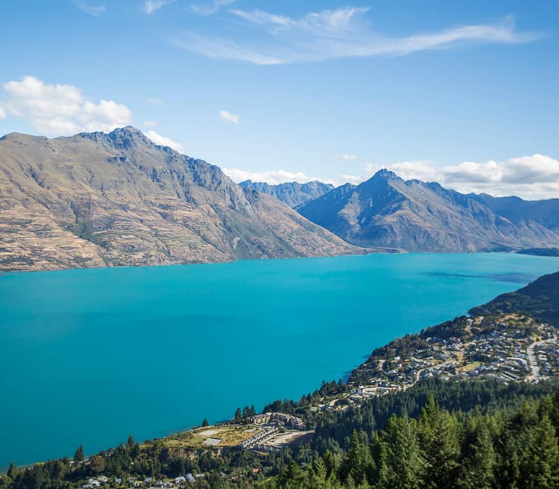 Scenic view of Lake Wakatipu and surrounding mountains in Queenstown, New Zealand.
