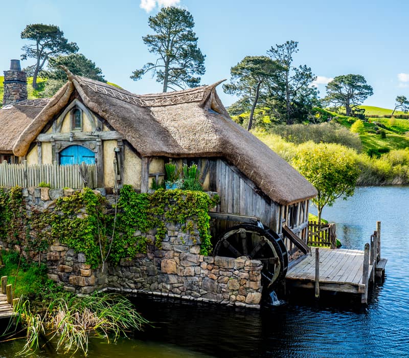 Hobbit home with a waterwheel outside 
