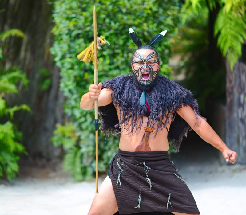 Māori Warrior welcoming guests to the Iwi