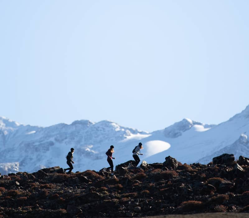 Group of runners running up Ruapehu. 