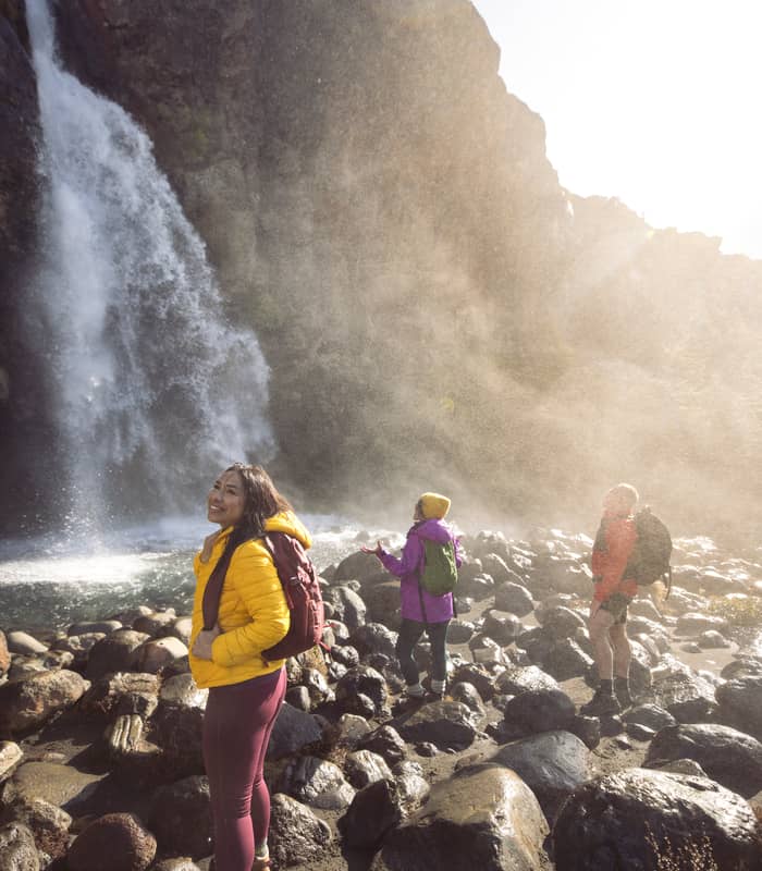 People at Taranaki Falls. 