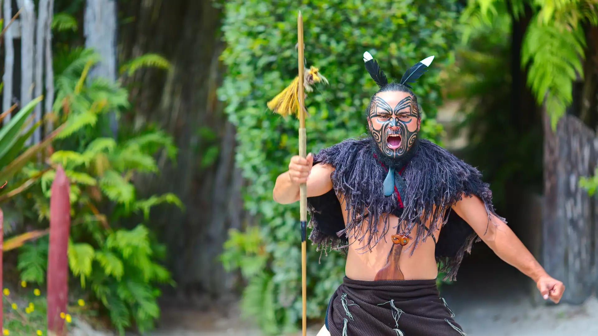 Māori Warrior welcoming guests to the Iwi