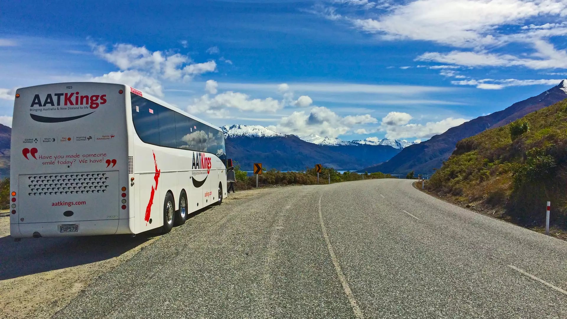 AAT Kings coach on road with mountains in new zealand south island