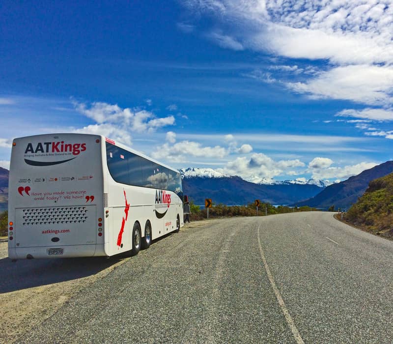 AAT Kings coach on road with mountains in new zealand south island