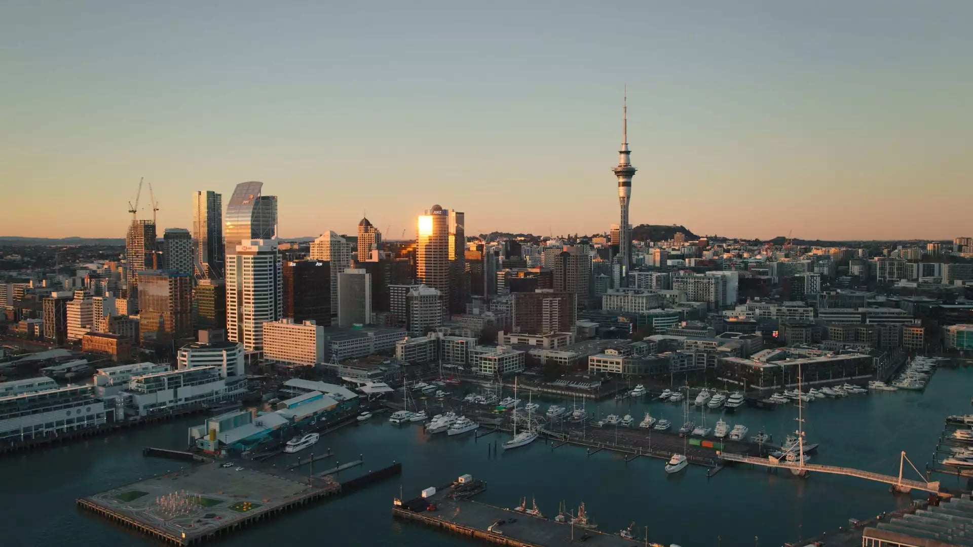 Aerial view of Auckland skyline with Sky Tower at dusk