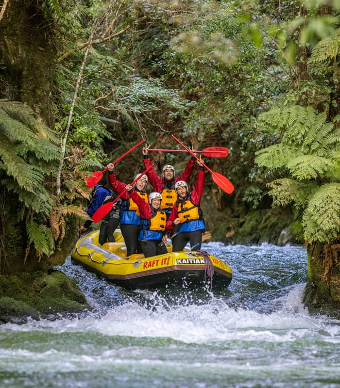 People rafting down river with Kaitiaki Adventures