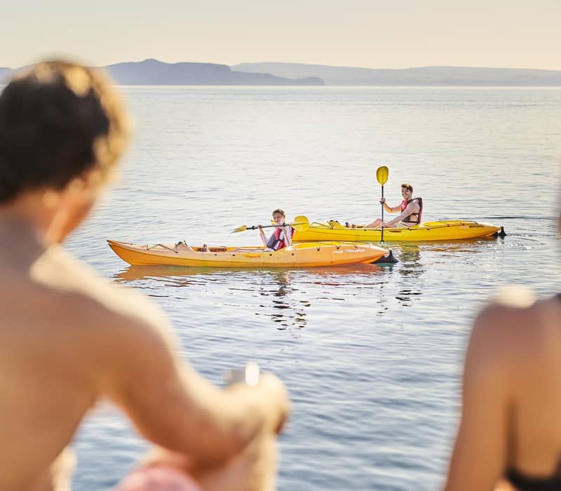 Couple watching kayakers on Lake Taupo.
