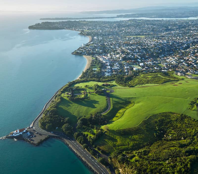 Aerial view of Mission Bay coastline and surrounding Auckland suburbs.