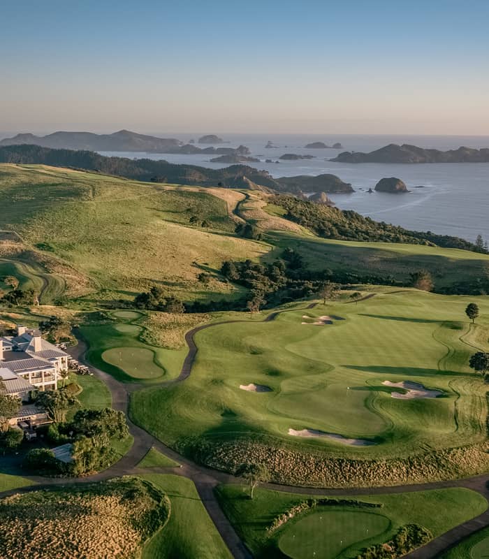 Aerial view of Rosewood Kauri Cliffs golf course overlooking the ocean in Northland, New Zealand.